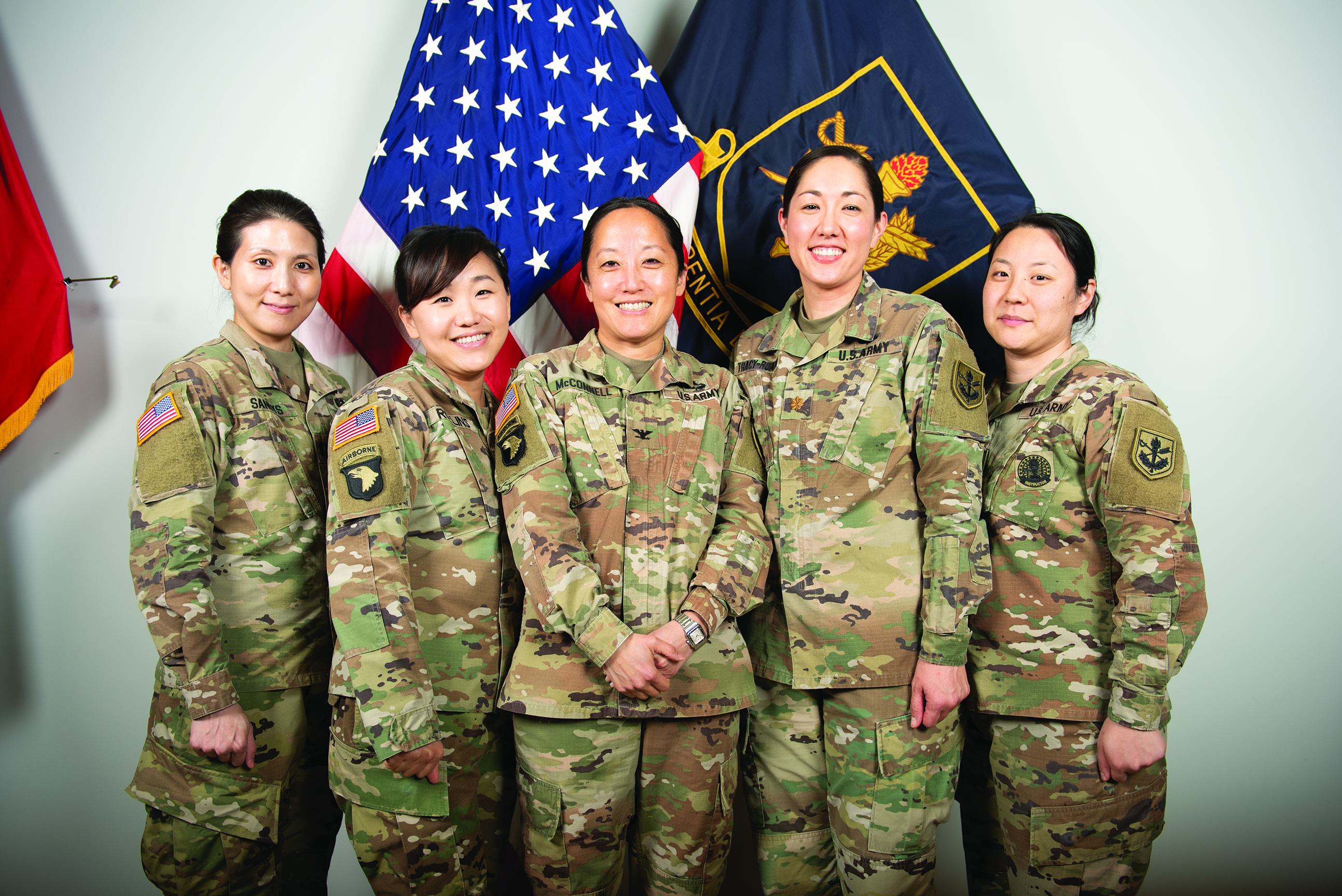 From left to right: MAJ Pearl Sandys, LTC Hana
        Rollins, COL Susan McConnell, MAJ Sara Tracy, and
        SSG Dana Song. (Credit: Jason Wilkerson/TJAGLCS)
